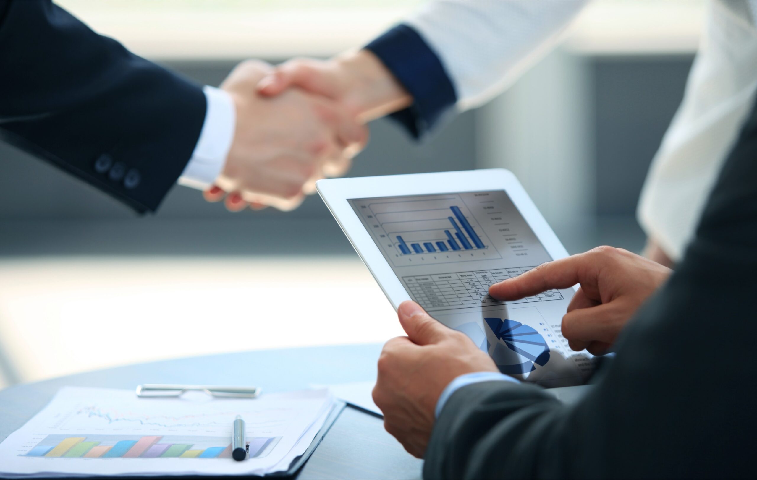 business-associates-shaking-hands-office