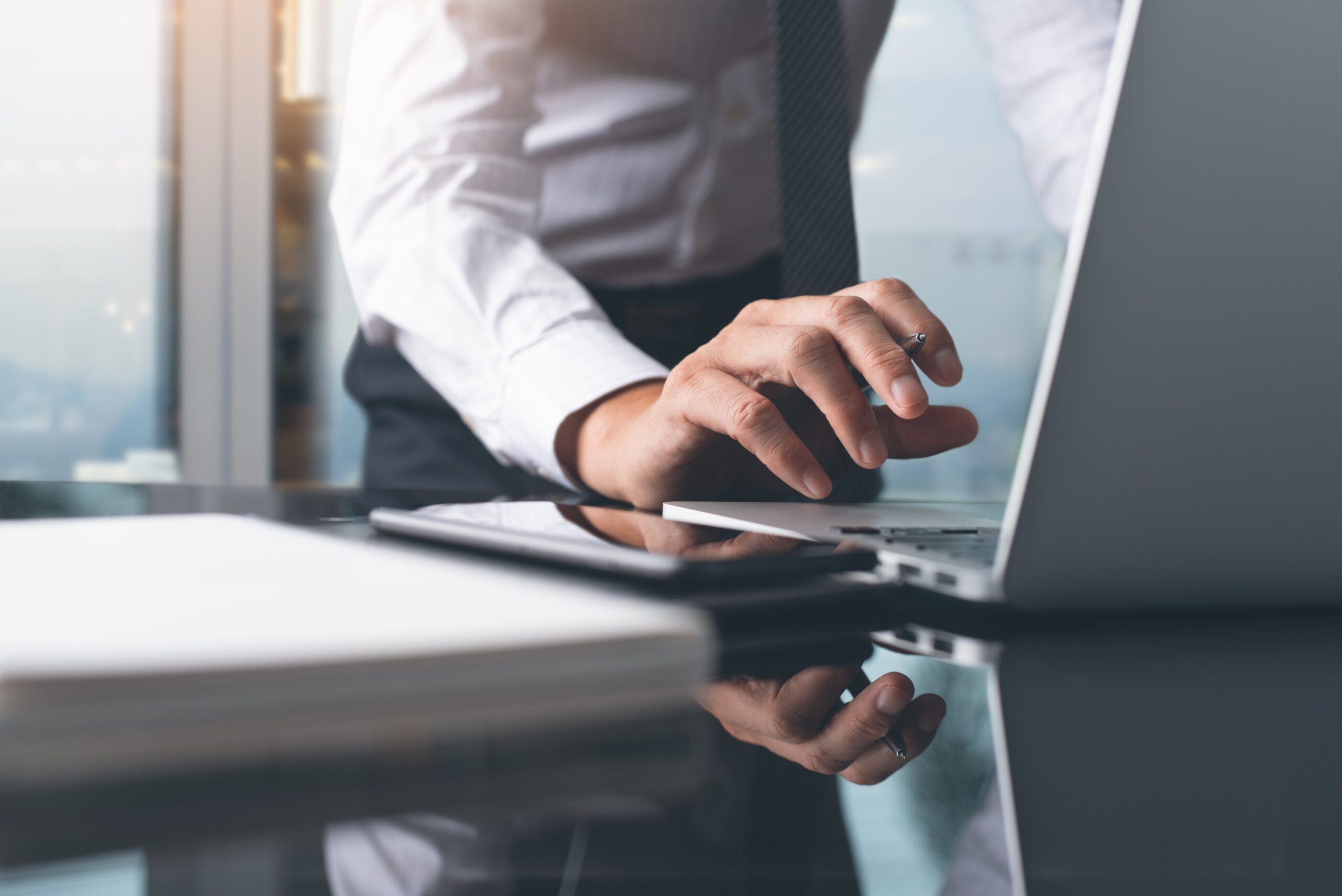 businessman-busy-working-laptop-computer-office-table